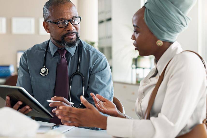 Woman talking to doctor